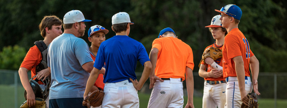 Meetings at the mound with our 14U team. Photo Credit: Ethan Hall